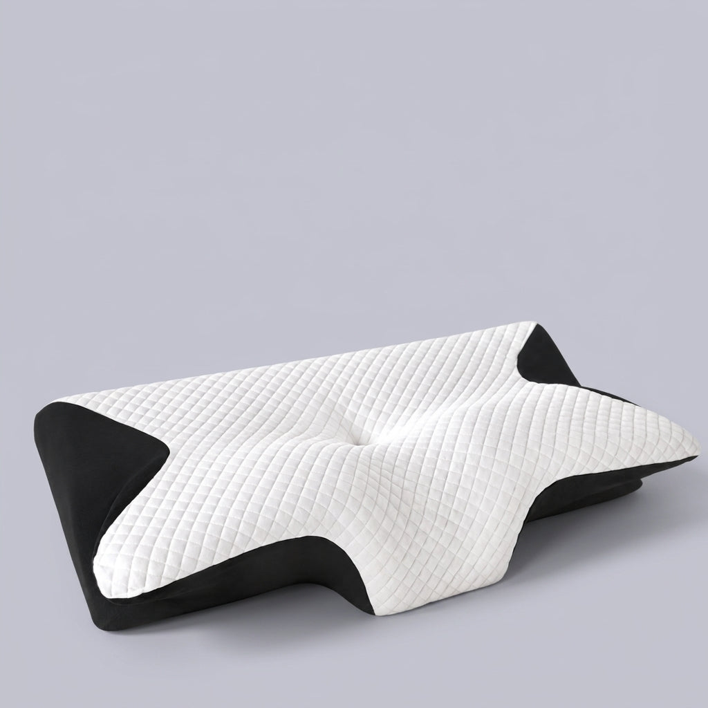 Almohada cervical mariposa ergonómica Luna, sobre fondo liso de estudio